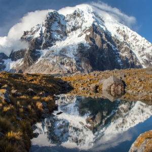The snowcapped Salkantay Mountain reflected in a high-altitude lake.