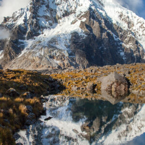 The snowcapped Salkantay Mountain reflected in a high-altitude lake.