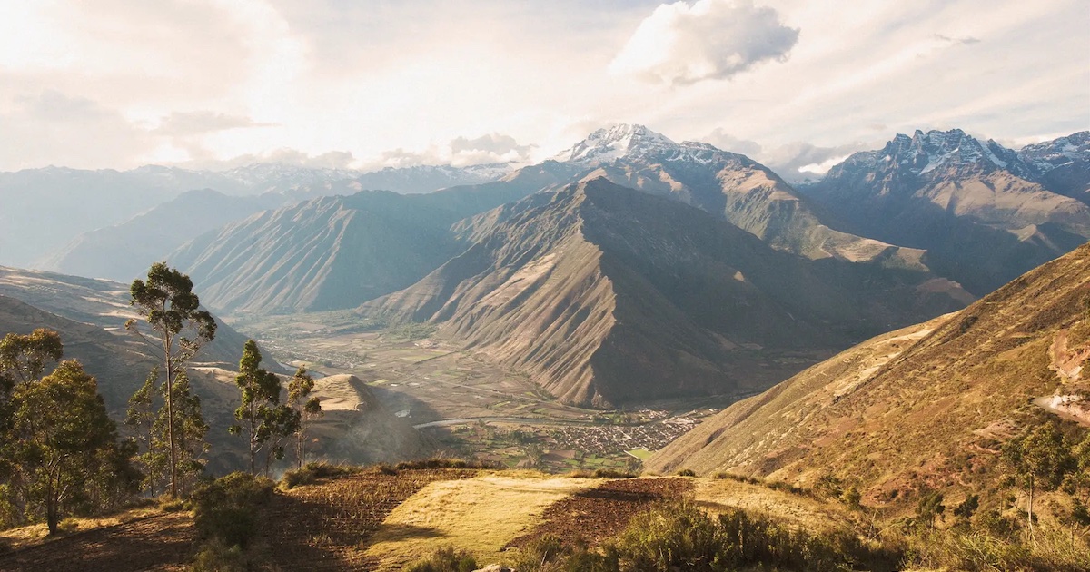 The town of Pisac and surrounding mountains, as seen from an elevated vantage point.