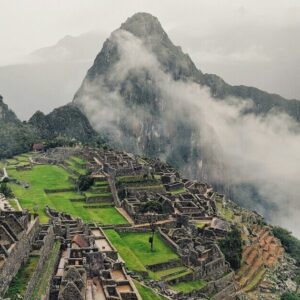 Fog creeping over the ruins of Machu Picchu.