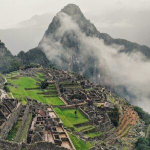Fog creeping over the ruins of Machu Picchu.