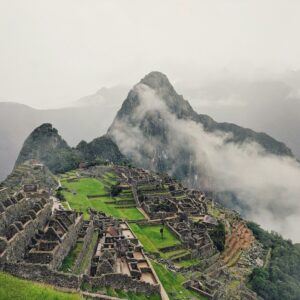 Fog creeping over the ruins of Machu Picchu.